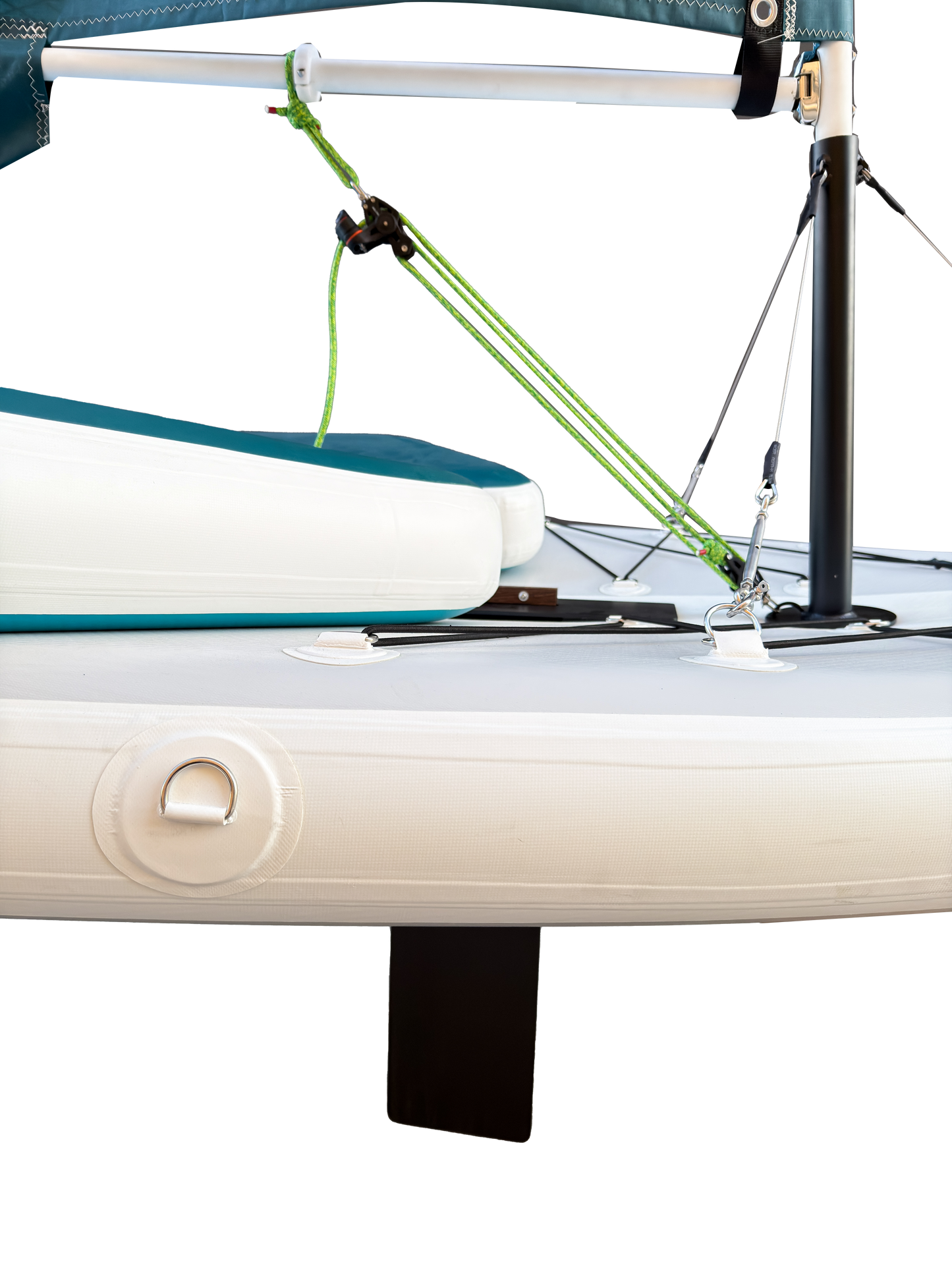 Close-up of a sailboat with a green sail and white hull.