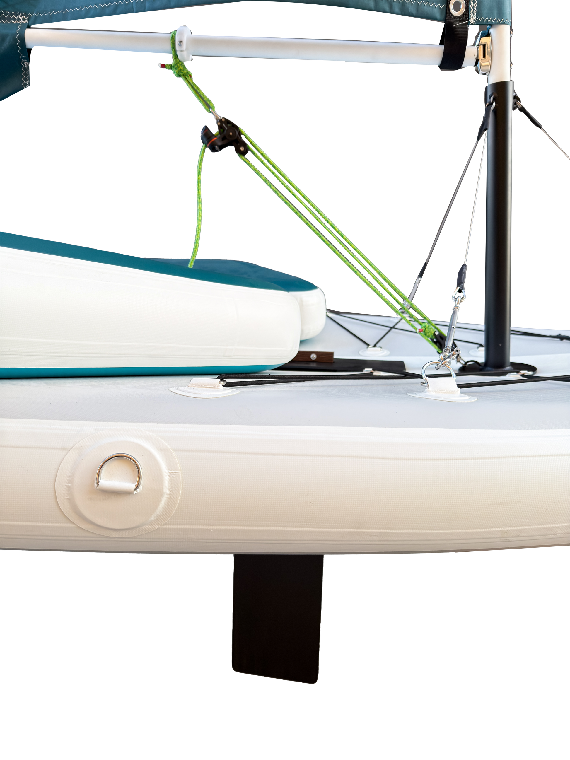 Close-up of a sailboat with a green sail and white hull.