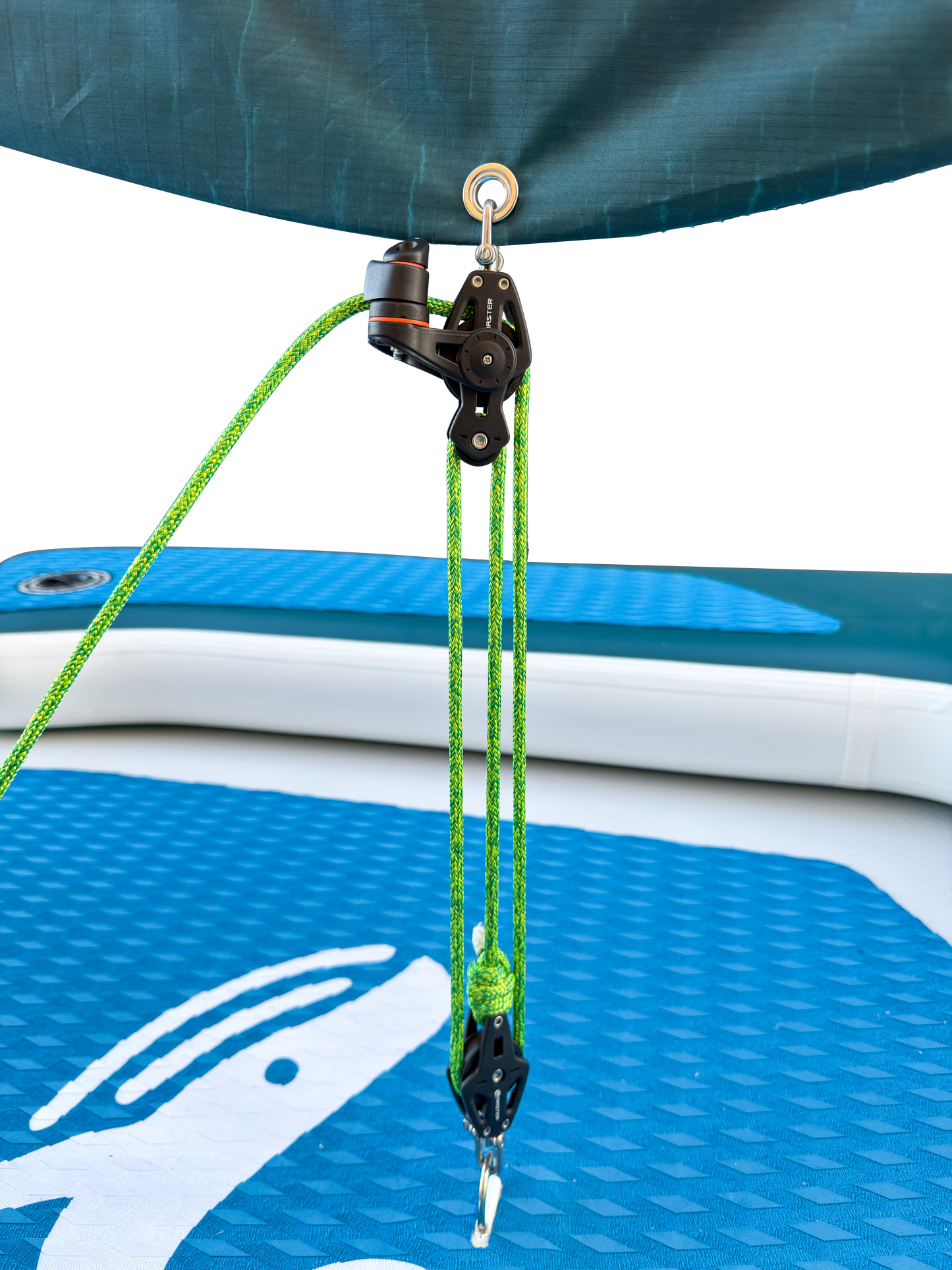 Close-up of a pulley system on an inflatable watercraft with green ropes.