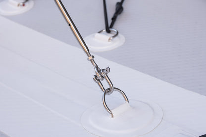 Metallic tool with a white object on a light gray background