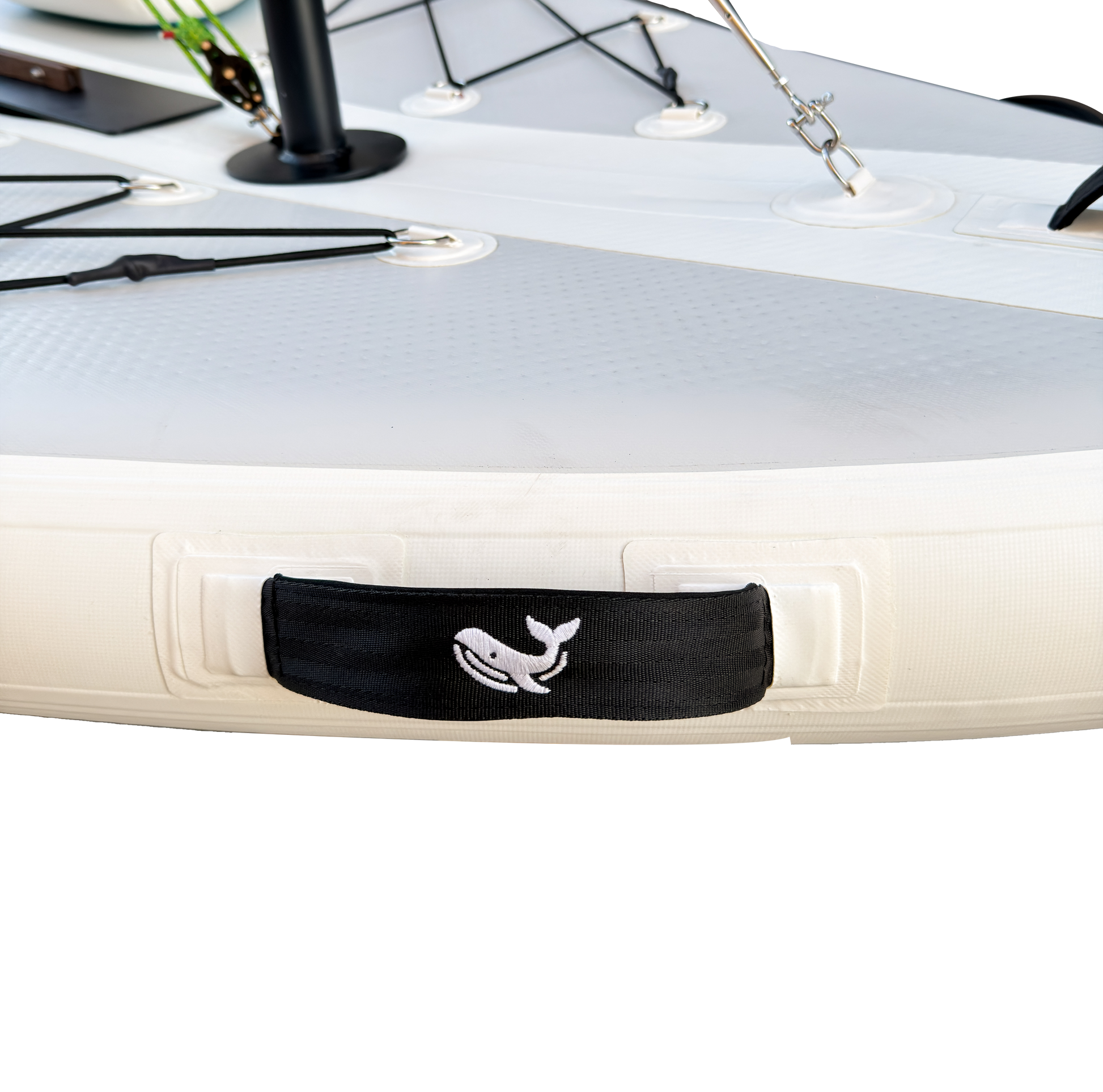 Close-up of a kayak with a black strap featuring a whale design on a white background