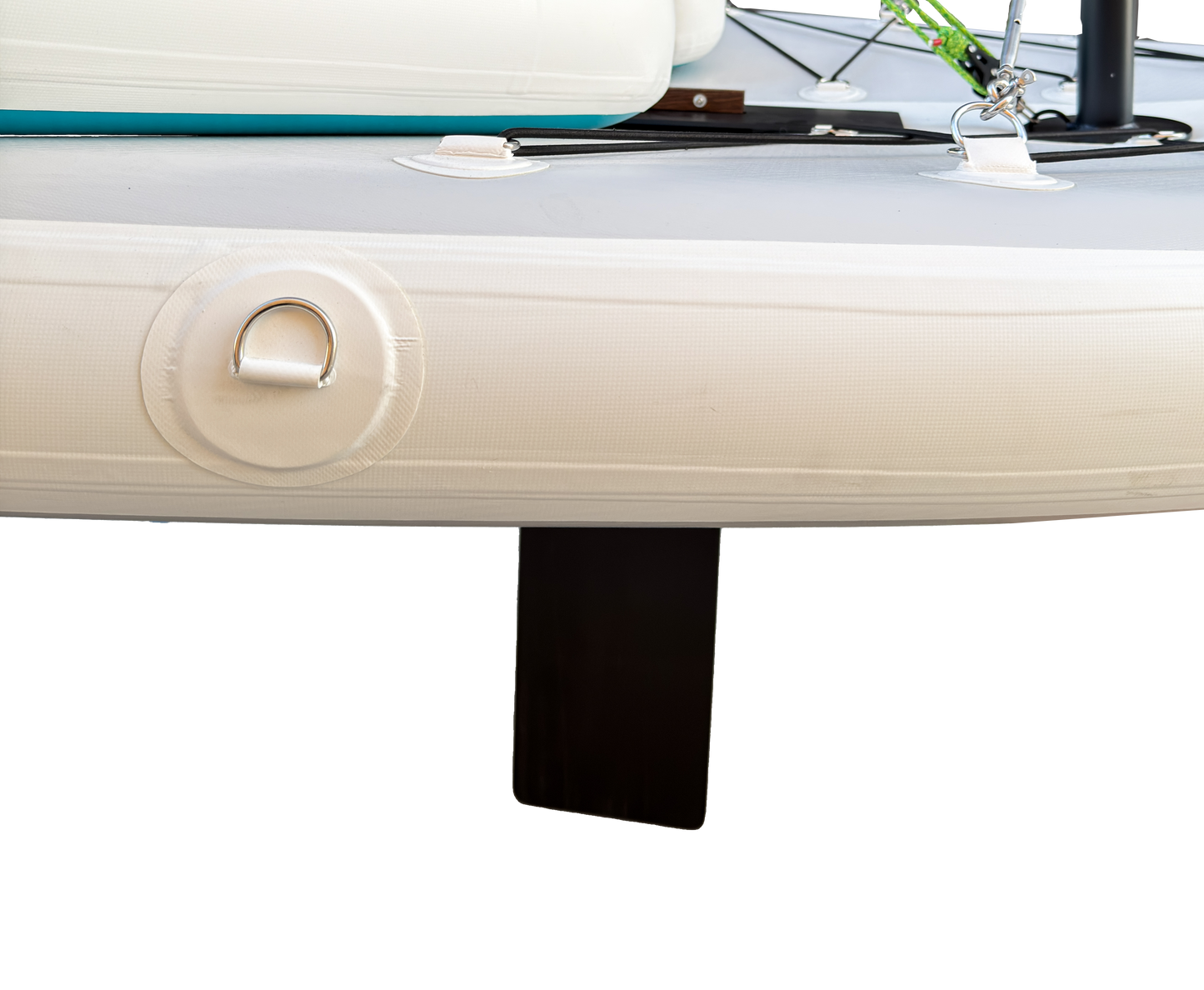 Close-up of a boat's white hull with a black fin on a white background