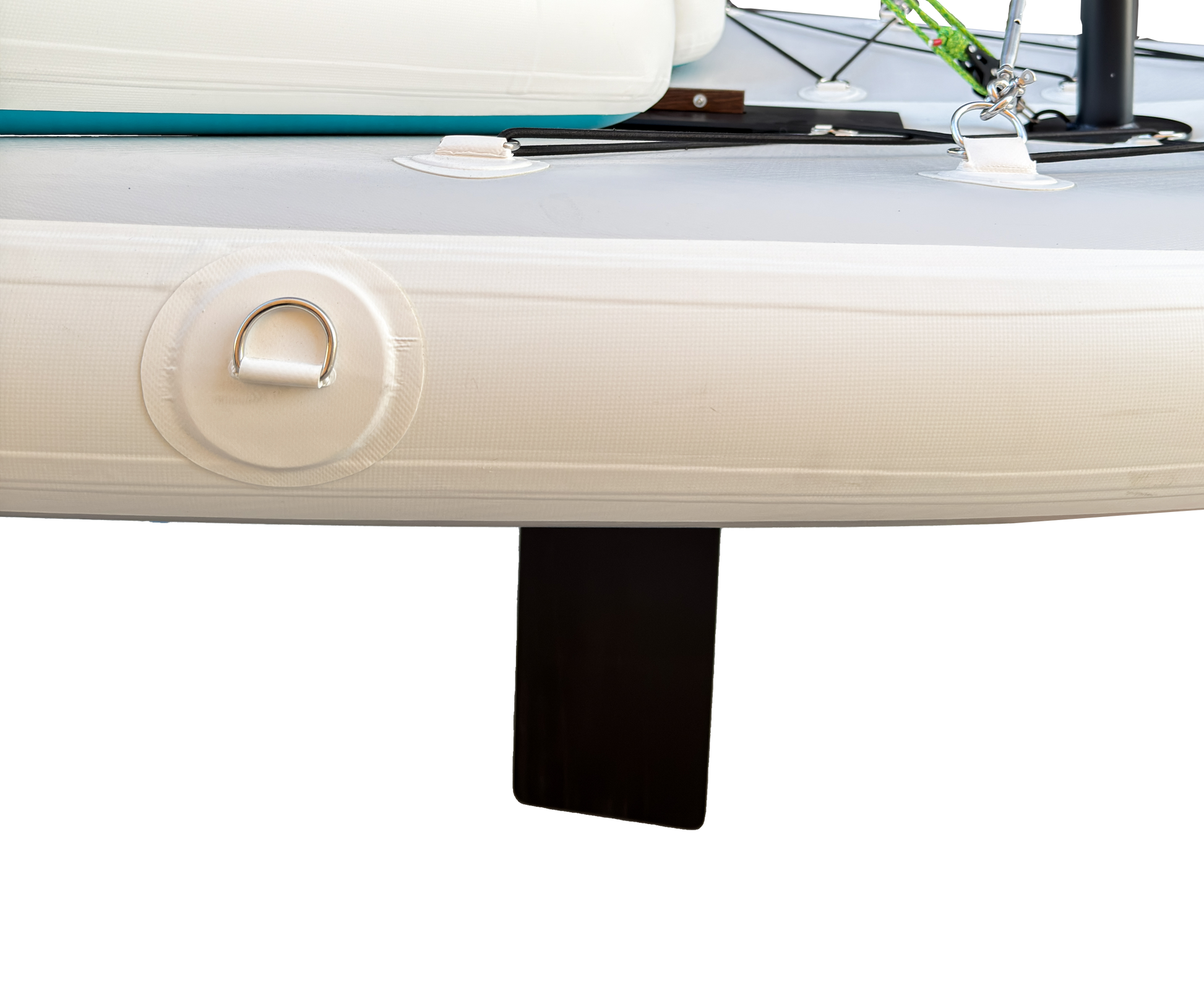 Close-up of a boat's white hull with a black fin on a white background