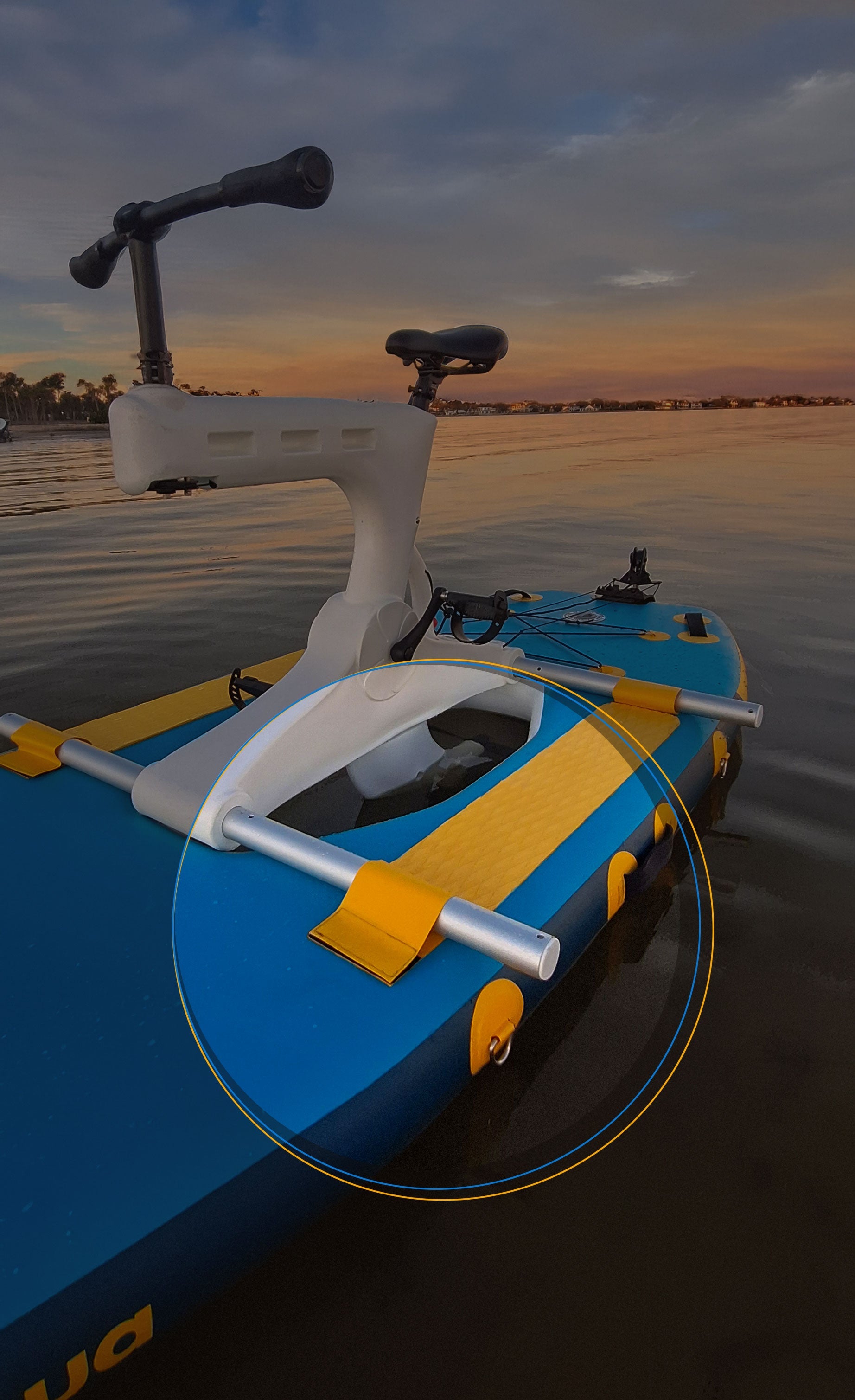 Blue and yellow water bike on a body of water with a sunset sky.