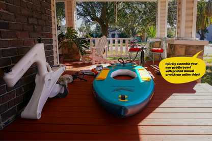 Blue paddle board with accessories on a wooden deck, with text about assembly instructions.