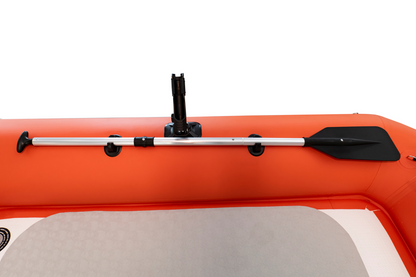 Inflatable kayak with a paddle attached on a white background