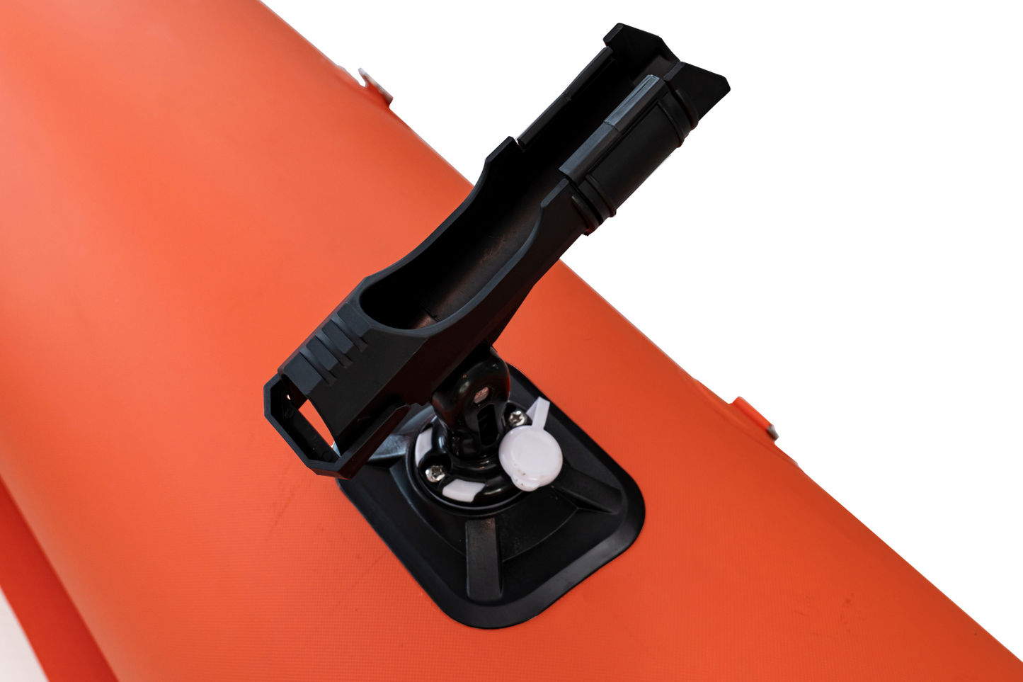 Black device attached to an orange surface