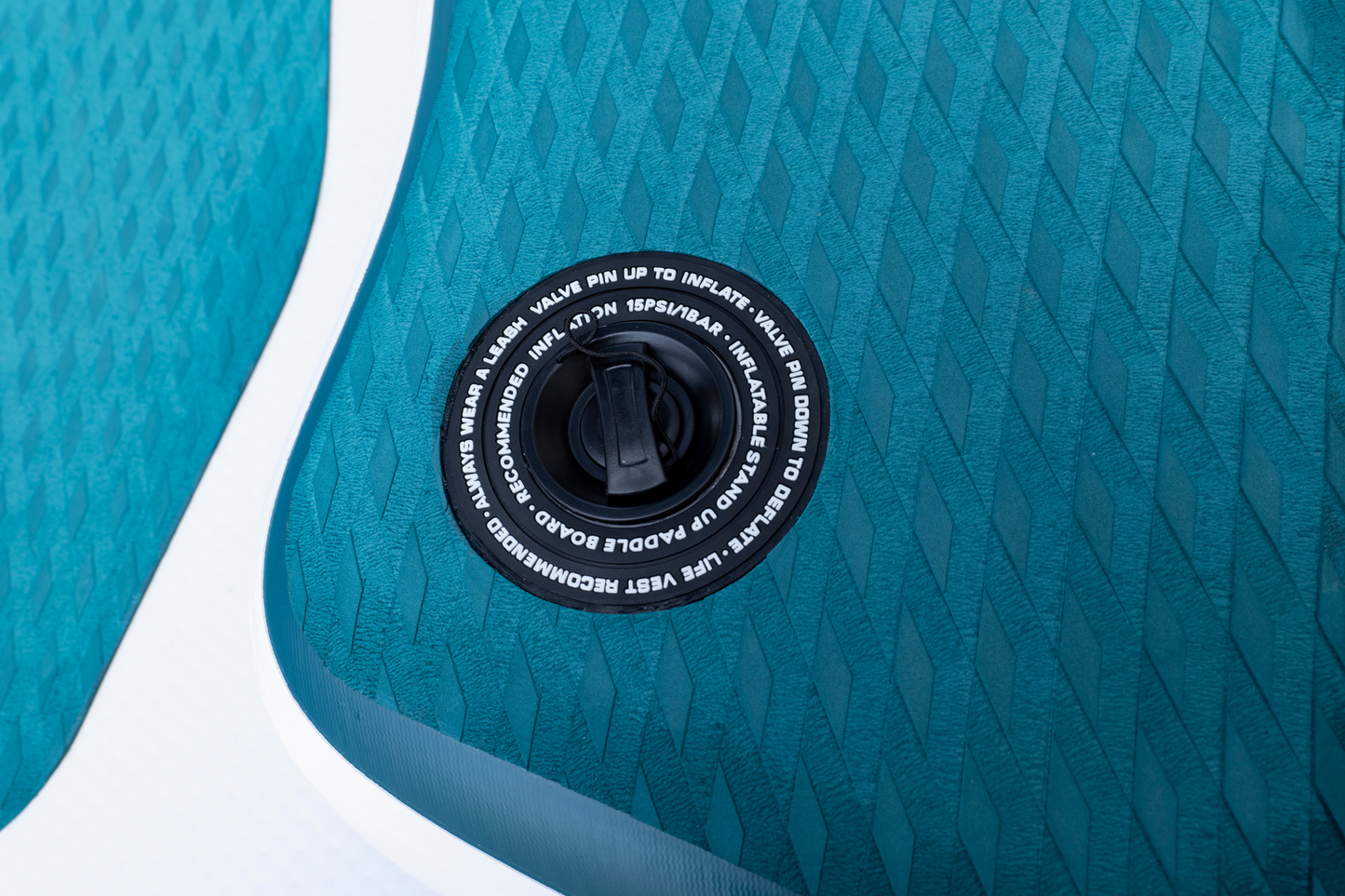 Close-up of a blue inflatable pool with valve cap detail