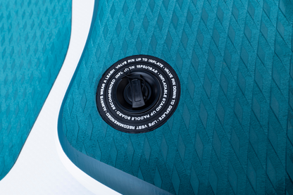 Close-up of a blue inflatable pool with valve cap detail