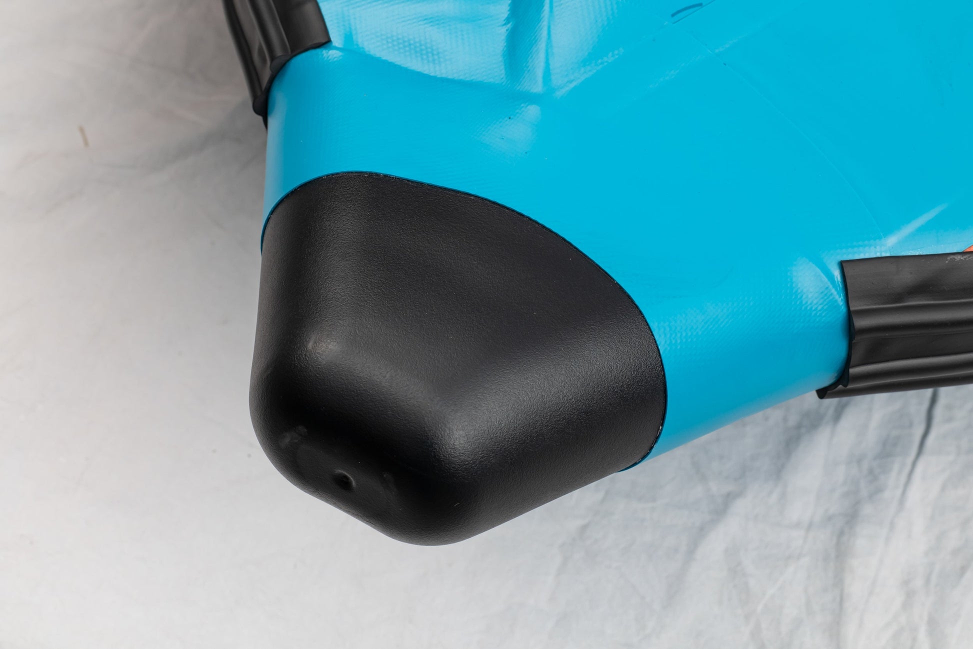 Close-up of a blue and black object on a white background