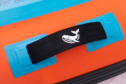 Black strap with a whale logo on a blue and orange background